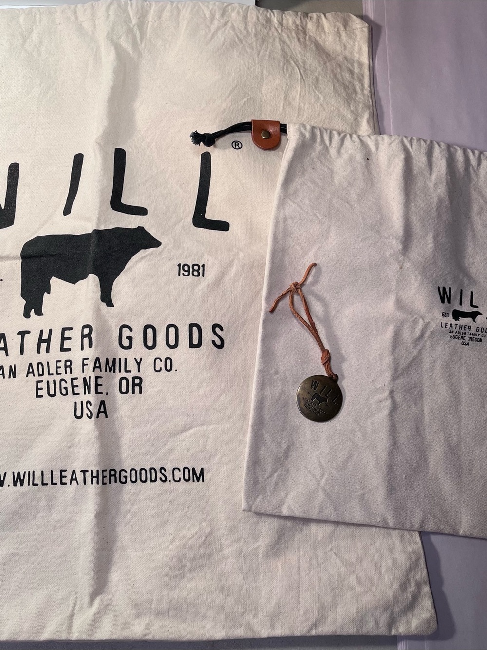 Will Leather Goods Dust cover bags with brass hang tag